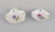 Meissen, 
Germany. Two 
porcelain bowls 
hand-painted 
with polychrome 
flowers. Gold 
rim.
Circa ...