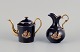 Limoges, 
France. 
Miniature 
Coffee pot and 
water jug in 
porcelain, 
decorated with 
22-karat gold 
...