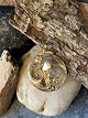 Pendant in 14 
carat gold
Stamped 585
Height with 
axe: 36.41 mm
Width: 28.40 
mm
Our ...