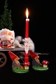 Old Swedish 
wooden 
Christmas 
candle holder 
with Santa 
Claus sitting 
with a red 
mushroom 
holding ...