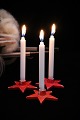 4 old Swedish star-shaped Christmas candle holders in painted porcelain for 
small Christmas candles...