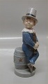 Royal 
Copenhagen 4524 
RC February - 
boy juggler 
Hans Henrik 
Hansen 16 cm  
In mint and 
nice condition