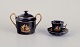 Limoges, 
France. Two 
pieces of 
porcelain 
consisting of a 
coffee cup and 
sugar bowl 
decorated ...