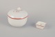 Meissen, 
Germany. A 
sugar bowl and 
a salt cellar. 
Decorated with 
coral red and 
gold-colored 
...