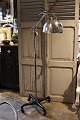 Old floor lamp on wheels in chrome with a fine patina...