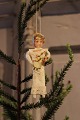 Old Christmas 
tree decoration 
in the shape of 
a little 
Christmas girl 
in paper, 
cotton wool and 
...