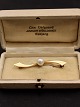 14 carat gold 
brooch L. 4.6 
cm. with 
genuine pearl 
subject no. 
560095