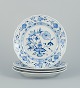 Meissen, 
Germany. A set 
of four Blue 
Onion Pattern 
dinner plates 
in porcelain. 
...