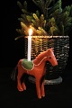 Decorative, old horse in carved wood with room for a small Christmas candle on 
the back...
