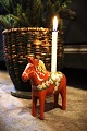 Decorative, old Swedish Dalar horse with room for a small Christmas candle on 
its back. 
H: 13.5cm...