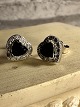Original 
Swarovski 
earrings.
heart shaped 
earrings. 
centered with 
Blue 
heart-shaped 
crystal, ...