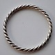 Twisted 
sterling silver 
bangle. 20th 
century 
Denmark. 
Stamped 925. 
Inner 
circumference: 
20 cm.