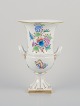 Herend, 
Hungary. Large 
porcelain vase 
with handles. 
Hand-painted 
with flower 
motifs and ...