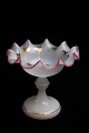 Fine, old opaline glass bowl on foot with wavy edge and decorated with gold 
leaves...