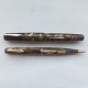 Green-marbled 
Eversharp 
fountain pen 
and pencil. 
There is a 
small crack at 
the opening of 
the ...