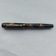 Green and black 
marbled Hoover 
No. 877 
fountain pen. 
Push button 
filler.  In 
good condition 
with ...