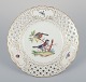 Meissen, 
Germany. Open 
lace porcelain 
plate. 
Hand-painted 
with a bird 
motif and 
insects, gold 
...