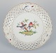 Meissen, 
Germany. Large 
open lace 
porcelain bowl. 
Hand-painted 
with a bird 
motif and 
insects, ...