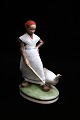 Royal 
Copenhagen 
porcelain 
figure of 
"goose girl" in 
overglaze. 
Decoration 
number: 528. 
1.sort. ...