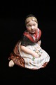Royal 
Copenhagen 
porcelain 
figurine of the 
"Fanö girl" in 
overglaze. 
Decoration 
number: 12416. 
...