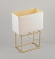 Designer table 
lamp in brass 
with a white 
fabric shade. 
Modernist and 
sleek design.
Late 20th ...