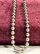 Sterling silver 
necklace, 
designed as a 
small ball. L 
86 cm. nice 
condition