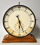 Junghan timekeeping clock, approx. 1930. Germany. On a polished oak base. With 60 minute hand ...