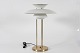 Poul Henningsen 
(1894-1967)
Original PH 5 
table lamp with 
lamp base of 
brass 
and shades of 
...