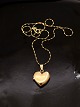 14 carat gold medallion heart 1.8 x 2 cm. and 14 carat chain 40 cm. subject no. 564297