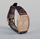 Omega De Ville 
men's 
wristwatch in 
brass.
1970s.
Quartz 
movement.
Everything on 
the watch is 
...