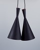 A pair of Tom 
Dixon, Beat 
Light Tall 
pendants, 
crafted in 
hammered metal 
coated with a 
matte ...