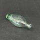 Length 15 cm.
Older glass 
bottle in 
blue-green 
glass.
It has a crack 
at the bottom 
and a ...
