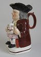 Toby Jug, 
England, 
ca.1780. 
Polycrom 
decoration, 
with girl and 
foaming beer 
mug. Restored. 
H: ...