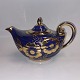 Teapot In 
ceramics from 
the Arthur Wood 
factory in 
England. 
Decorated with 
flowers in gold 
on a ...