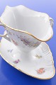 Royal 
Copenhagen 
porcelain. Hand 
painted Saxon 
flower. Sauce 
boat on fixed 
stand, no. 
1221/1650. ...