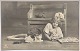 Postcard: Girl with three cats and postcard album in 1913
