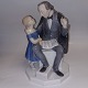 Bing & Grøndahl 
figure in 
porcelain with 
H. C. Andersen 
reading to 
little girl 
Appears in good 
...