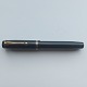 Black flat-top 
Parker Duofold 
fountain pen. 
"Push-button" 
filler. Does 
not work. A new 
rubber ...