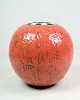 Lene Regius' round vase with black and white top, orange glaze and black patterned engravings ...