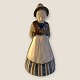Bing & 
Grøndahl, Woman 
in regional 
costume #7205/ 
10, 24cm high, 
12cm in 
diameter, 2nd 
sorting, ...