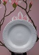 Royal 
Copenhagen 
White Full lace 
dinner 
plate.Dia.: 
25cm. 
Decoration 
number: 1084. 
1.sort. ...