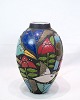 This large ceramic floor vase is a beautiful ornate object, decorated with motifs of birds and ...