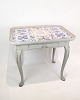 The rococo tile 
table, painted 
gray and dated 
1780, is a 
charming 
example of 
classic 
furniture ...