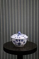 Royal 
Copenhagen Blue 
Fluted Plain 
sugar bowl with 
lid. 
H: 7cm. Dia.: 
9cm. Decoration 
number: ...