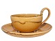 Kähler art 
pottery, yellow 
tea cup with 
high handle and 
matching 
saucer.
The cop 
measures 9.9 
...