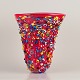 Murano, Italy.
Large art 
glass vase. Red 
mouth-blown 
glass.
Small figures 
in various ...
