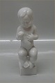 Bing and 
Grondahl B&G 
2230 Baby with 
apple "Eve"  17 
cm
 Marked with 
the three Royal 
Towers of ...