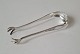 Empire sugar 
tongs in silver 
from 1904 
Stamped the 
three towers 
1904 - O.F.D
Length 12 cm.