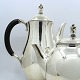 Georg Jensen 
coffee and tea 
set of lightly 
hammered 
sterling 
silver, 
designed by 
Harald Nielsen. 
...