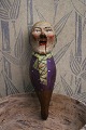 Decorative, old nutcracker in carved wood in the shape of an elderly gentleman 
with fine old painting...